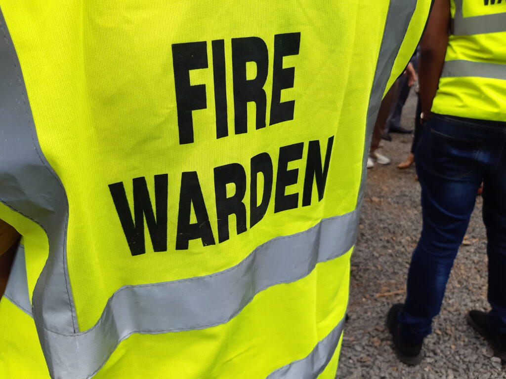 Yellow,Jacket,Showing,Fire,Warden,On,Duty.,Safety,Background.